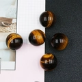 Polished 25mm tiger eye stone spheres with natural brown stripes for home decor - Tiger's Eye