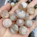 Translucent 20mm natural agate stone ball with white cloud-like textures in light purple - Cherry Blossom Agate
