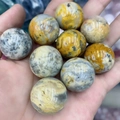 Polished 25mm bumblebee jasper stone ball with unique yellow and black natural patterns - Crazy Agate