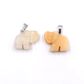 Natural quartz elephant pendant set in creamy white and translucent orange stone - Topaz