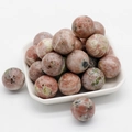 Polished 20mm unakite gemstone sphere with green and pink mottled pattern texture - Plum Blossom Stone