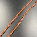 Strand of 4mm reddish-brown goldstone round beads with sparkling metallic glitter effect - Gold Sandstone