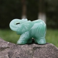 Green Aventurine gemstone elephant figurine with detailed carvings and raised trunk - Green Aventurine