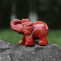 Hand-carved red jasper elephant figurine with natural black veins on stone base - Red Jasper
