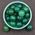 Green translucent natural agate 20mm round beads stacked in a ceramic bowl - Green Agate