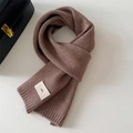 Thick knitted brown winter scarf with a minimalist brand label on a soft fabric - 20x156cm / Coffee