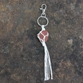 Handmade macrame keychain with raw reddish-brown stone and white bohemian tassels - Red Jasper
