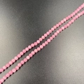 4mm pink crystal quartz round beads for DIY jewelry making neatly arranged on dark background - Rose Quartz