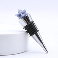 Star-shaped blue lapis crystal wine bottle stopper with polished stainless steel base - Blue Spot Stone