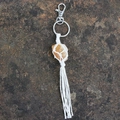 Handwoven orange raw stone keychain with white cotton net and a silver clasp - Citrine