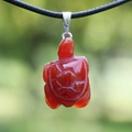 Red agate gemstone necklace pendant featuring a hand-carved turtle shape with a black cord - Turtle