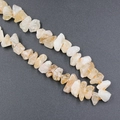 Irregular natural yellow citrine stone beads with authentic mineral textures on orange string - Citrine