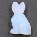 Cat-shaped opal gemstone ornament with a translucent white finish and blue glow - Synthetic Opal