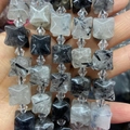 Perle in quarzo rutilato nero a forma di X con inclusioni naturali ad ago - Quarzo Rutilato Nero