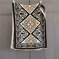 Detail of geometric ethnic pattern on thick winter shawl with fringe decorations - Black
