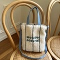Lamb wool tote bag in off-white with blue handles and wonder natural embroidery - Cream White Wonder Embroidery Style / Off White