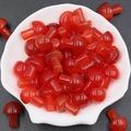 Polished red cat eye crystal mushroom stones in a white bowl for garden decor - Red