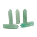 Set of five light green Aventurine quartz hexagonal crystal pillars on white background - Green Aventurine