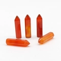 Five hexagonal red carnelian crystal points with natural orange tones and polished finish - Red Agate