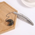 Silver metal feather bookmark featuring a dragon blood stone crescent moon pendant - Dragon Blood Stone