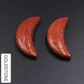 Paire de pierres précieuses Goldstone en forme de lune avec paillettes métalliques - Pierre de Sable d'Or