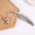 Silver feather metal bookmark with natural crescent agate stone pendant detail - Crazy Agate