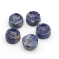 Five sodalite crystal ball stands featuring natural deep blue marble texture - Blue Sodalite