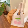 Fleece shoulder bag with pink cherry embroidery and checkered lining on wooden chair - Pink Plaid Patchwork Cherry Lambswool Style (Without Pendant)