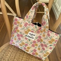 Floral canvas tote bag with pink and orange flowers on a stylish wooden chair - Orange Pink Small Flower
