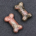 Natural pink rhodonite crystal bone-shaped carvings with smooth polished finish - Rhodonite