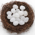Polished egg-shaped white quartz crystal stones nested in a brown decorative bird nest - Clear Quartz (1pc)