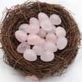 Polished rose quartz egg stones displayed in a natural bird nest for Easter decor - Rose Quartz (1pc)
