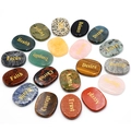 Polished natural crystal worry stones with engraved inspirational words on white background - 20 Random Words