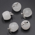 Five translucent white crystal apple pendants with silver leaf details on grey background - Clear Quartz 1PC
