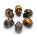 Set of 6 natural tiger eye crystal skull carvings with golden stripes for Halloween - Tiger's Eye