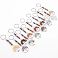 Porte-clés Arbre de Vie avec cristaux de chakra naturels et design filaire sur fond blanc - Aléatoire