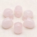 Set of 1-inch rose quartz skull carvings with polished pink natural stone finish - Rose Quartz