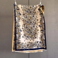 Detailed close-up of cashmere-like scarf with paisley jacquard and white fringe trim - 192x65cm / Off White
