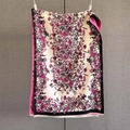 Detailed view of paisley cashmere-feel scarf featuring intricate pink floral prints and fringe - 192x65cm / Natural With Black Edge