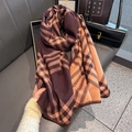 Detailed close-up of brown and orange classic plaid cashmere scarf on a leather seat - 53*192cm / Brown Coffee