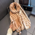 Detailed view of earth-toned plaid scarf with refined stitching and high-quality texture - 53*192cm / Caramel color
