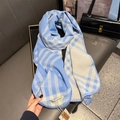 Detailed view of the fine stitched edge and soft texture of a blue plaid cashmere scarf - 53*192cm / Creamy Blue
