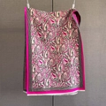 Close-up of paisley pattern knit scarf in rose red and black with delicate white tassels - Rose Red