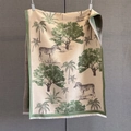 Detail of tropical pattern scarf featuring zebra and palm trees with white tassels - Green