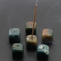 Natural agate stone cube incense holder with dark green and brown mineral patterns - India Agate