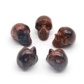 Set of five polished mahogany obsidian crystal skull carvings for Halloween decor - Mahogany Obsidian