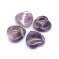 Set of four polished natural purple amethyst heart-shaped worry stones with white banding - Amethyst