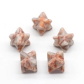 Set of five natural white and red marble Merkaba stars with unique vein patterns - Red Network Stone