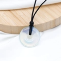 Minimalist amethyst donut necklace with white opal-like gemstone and black woven cord - Opal (Synthetic)