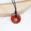 Natural Red Jasper donut pendant necklace with black braided cord and stone texture - Red Jasper